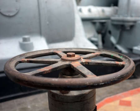 Old rusty valve in an old electricity power plantの写真素材
