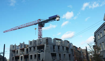 Construction of a modern building with craneの写真素材