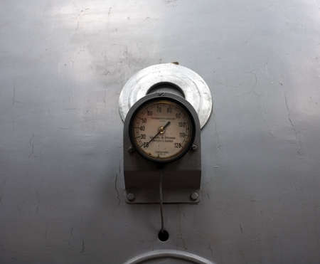 Old rusty thermometer in and old power plant in Gent, Belgiumの写真素材