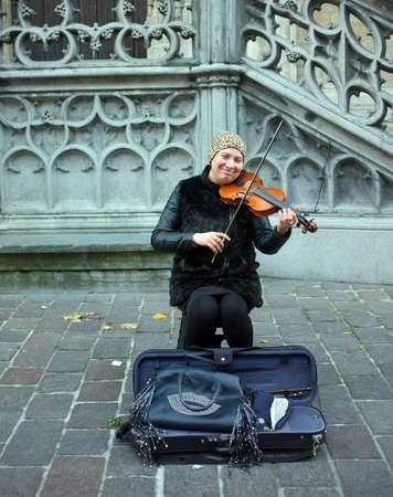 Street musician plays violin on the street in Ghent, Belgiumのeditorial素材