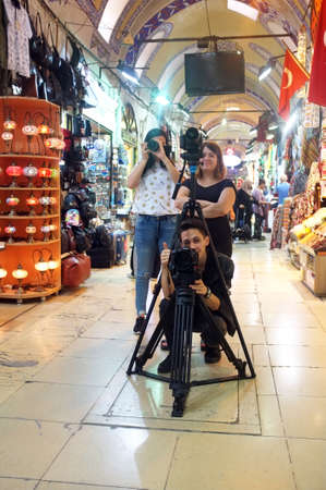 Three photographers shoot inside Grand Bazaar in Istanbul.のeditorial素材