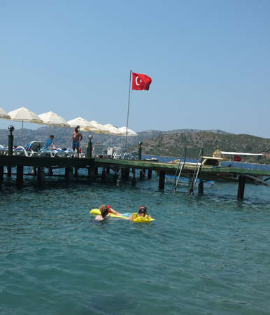 Family enjoys water during summer holiday near jetty in Marmaris, Turkeyのeditorial素材