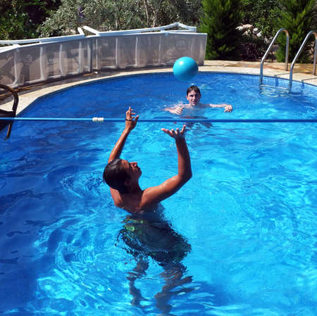 Young boys play voleyball in small pool in Marmaris, Turkeyのeditorial素材
