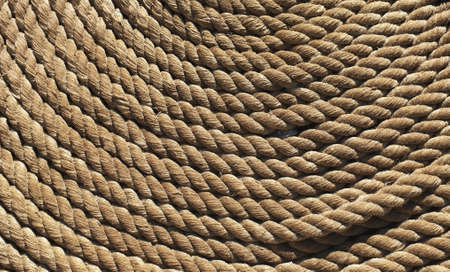 Nautical rope with gold colour as background imageの写真素材