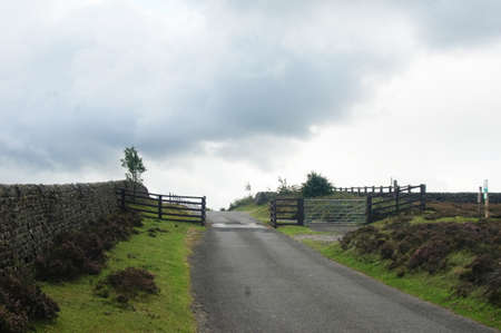 Rural country road with wooden gate in Yorkshireの写真素材
