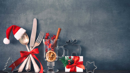 Christmas table setting with cutlery, christmas tree and decorationsの素材
