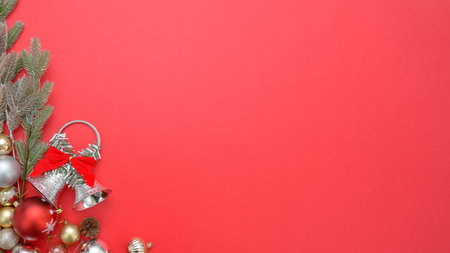Christmas and New Year decoration on red background. Top view with copy spaceの素材