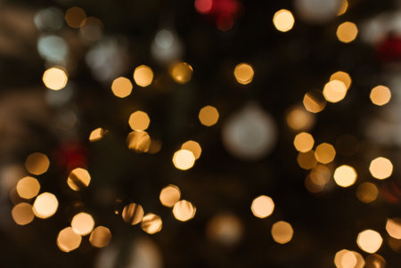 Defocused abstract bokeh lights on christmas tree background.の素材