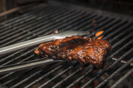 Caramelized Pork Ribs Being Prepared in Josper Grillの写真素材