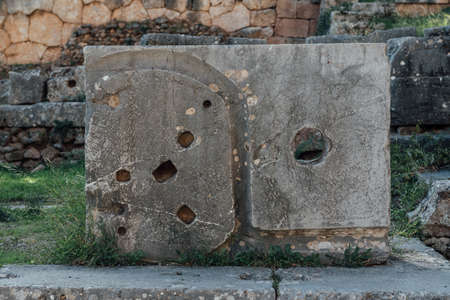 Delphi, Greece, November 19, 2019: stone detail of the most important ancient Greek temple and oracle of Apolloのeditorial素材