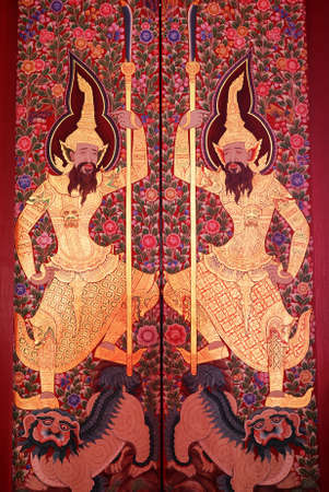 BANGKOK, THAILAND - AUGUST 17   Traditional Thai ancient painting art on wood door at Wat Mahathat Yuwaratrangsarit on August 17, 2013 in Bangkok, Thailandのeditorial素材