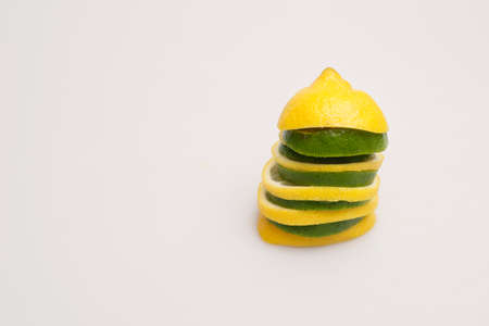 Fresh wet lime and lemon on a white background 