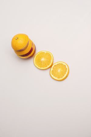 Apple and orange stacked togetherの写真素材
