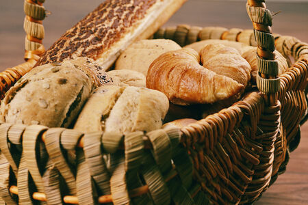 Bread Rolls in a basket with butterの写真素材
