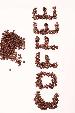 Brown coffee beans isolated on white backgroundの写真素材