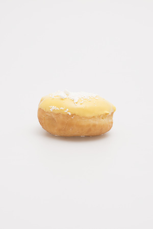 Fresh baked single donut on a white background 