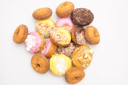 Assorted donuts on a white background の写真素材