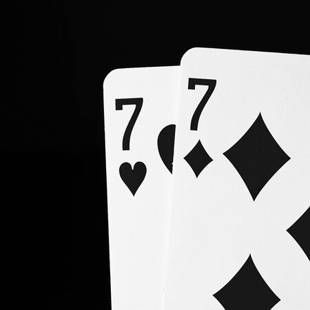 A pair of high contrast black and white image of playing cards close up.の写真素材