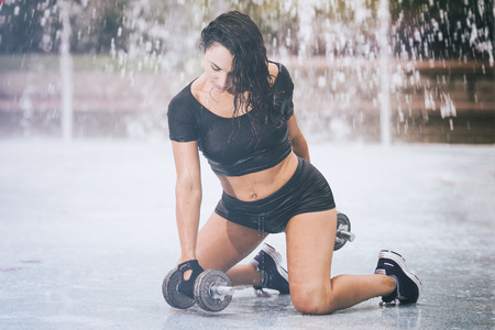Fitness girl working out in the parkの写真素材