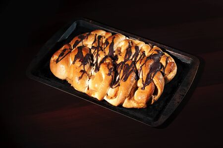 Chocolate and caramel danish pastry on a baking tray