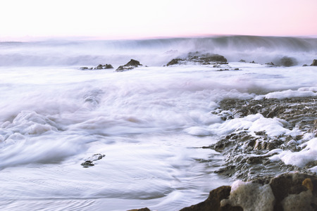 Sea foam created by the agitation of seawater located at Snapper Rocks Gold Coast New South Wales border.の写真素材