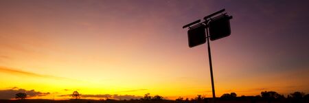 Rusted fuel station silhouette sign in the outbacks of Brisbane Queensland.の写真素材