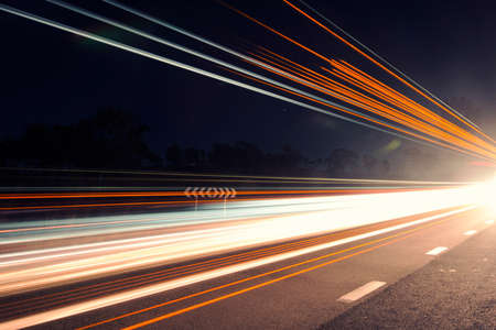 Light trails at night with stars in the outback of Brisbaneの写真素材