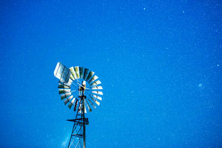 Stars and a windmill at night in the outback of Brisbane Queensland Australia.の写真素材
