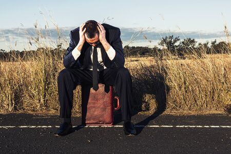 Concept: A frustrated business man is leaving the corporate lifestyle and chasing freedom in the outback of Queensland, Australia. Cinematic Portrait Style.の写真素材