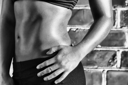 Female fitness model posing in studio. Cinematic Portrait Style.の写真素材