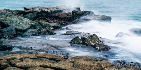 Rocks and waves at Point Cartwright beach in the afternoon. Sunshine Coast, Queensland.の写真素材