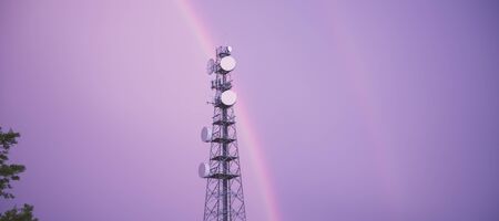 Radio tower in the after a storm with a rainbow in Redbank Plains, Brisbane, Queensland.の写真素材