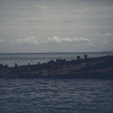 Shipwrecks at Tangalooma Island in Moreton Bay with a dark and gloomy effect.の写真素材