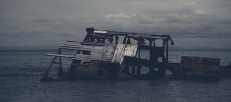 Shipwrecks at Tangalooma Island in Moreton Bay with a dark and gloomy effect.の写真素材