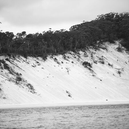 View of the pristine beachfront at North Point, Moreton Island during the day. Black and White.の写真素材