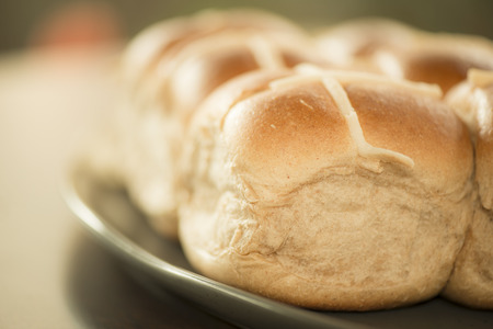 Tasty traditional Easter hot cross buns, closeup view.の写真素材