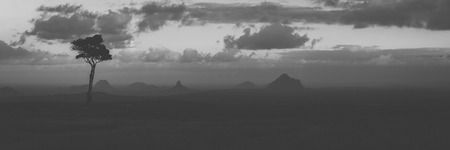 View of one tree hill on a foggy day in the Glass House Mountains, Sunshine Coast.の写真素材