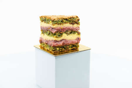 Detailed close up of a Persian Strawberry Rosewater Pistachio Torte slice