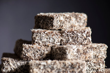 Soft and fluffy lamington fingers with a rich chocolate layer and fine shredded coconutの写真素材