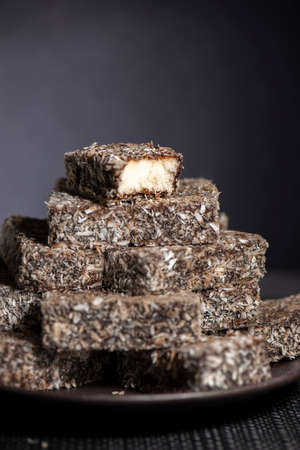 Soft and fluffy lamington fingers with a rich chocolate layer and fine shredded coconutの写真素材