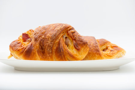 Freshly baked savoury Ham and Cheese Croissantの写真素材