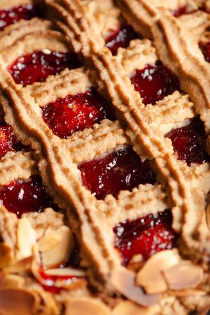 The Linzer torte is a traditional Austrian pastry, a form of shortbread topped with fruit preserves and sliced nuts with a lattice design on top.の写真素材