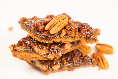 Golden crunchy fresh baked pecan diamond cookies made on a rich short dough.の写真素材