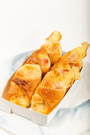 Flakey and buttery golden brown ham and cheese croissantsの写真素材