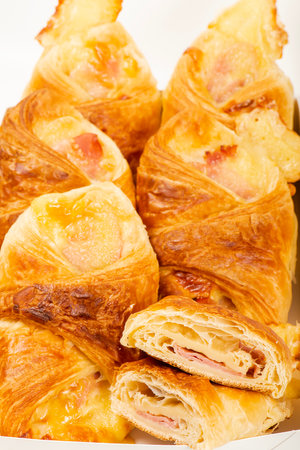 Flakey and buttery golden brown ham and cheese croissantsの写真素材