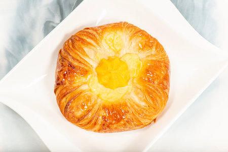 Mouth-watering mango and custard danish brushed with simple syrup.の写真素材
