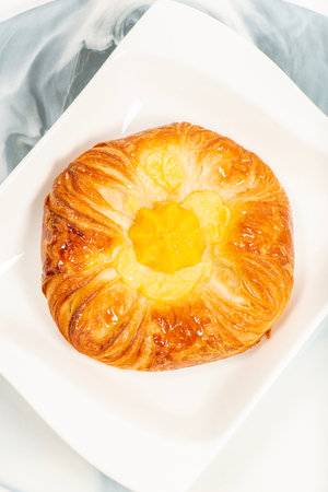 Mouth-watering mango and custard danish brushed with simple syrup.の写真素材