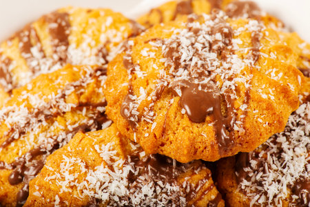 Fresh-baked Snickerdoodle cookies with chocolate and shredded coconut.の写真素材