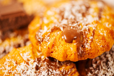 Fresh-baked Snickerdoodle cookies with chocolate and shredded coconut.の写真素材