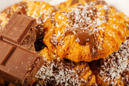 Fresh-baked Snickerdoodle cookies with chocolate and shredded coconut.の写真素材